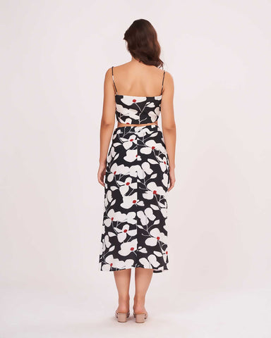Rear view of the co-ord set, highlighting the back zip closure and clean fall of the floral wrap skirt.