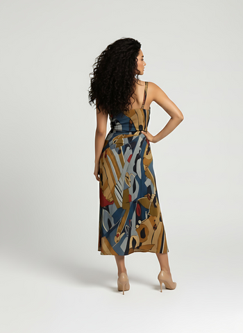 Contemporary midi dress with clean square neckline, soft drape, and artistic geometric print for effortless resort elegance