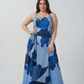 Curve fit crepe dress with a halter neckline and adjustable tie-back, designed to create a balanced and flattering shape