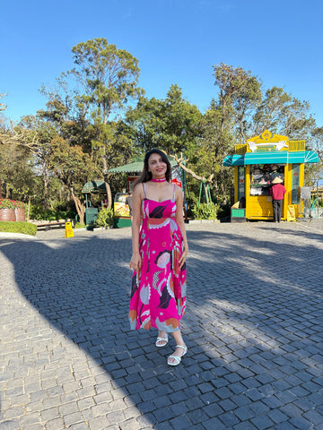 Elegant pink printed midi dress styled for daytime celebrations and brunch outings